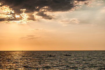 wo Kayakers Kayak into The Sunset