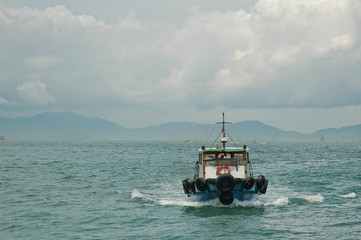 Motor ferry sailing in Hong Kong bay
