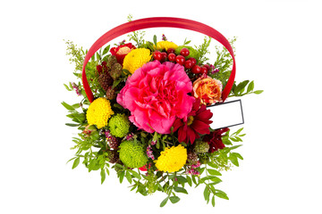 bright arrangement of flowers in basket, isolated background