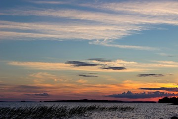 Beautiful tranquil summer sunset on the Onega lake, Karelia, Russia