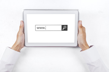 Hand with www text on table computer