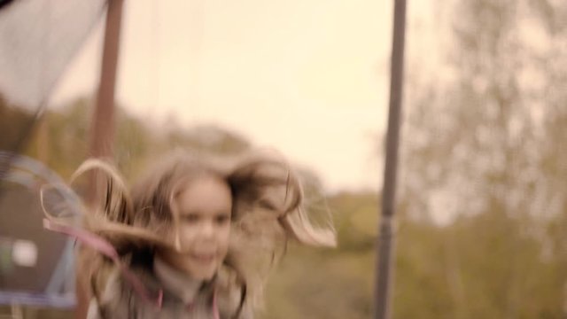 Girl jumping on a trampoline