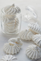 Close-up shot of white meringues on a white background