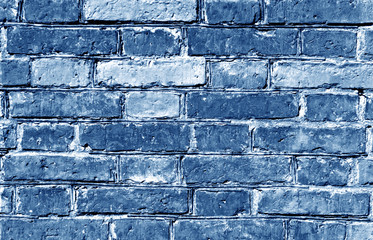 Weathered blue toned brick wall surface.