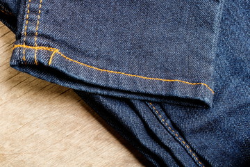 Jeans or denim on a wooden background 