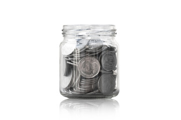coins in a glass jar against ,savings coins - Investment And Interest Concept saving money concept, growing money on piggy bank. isolated on white background