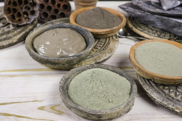 Obraz na płótnie Canvas Ancient minerals - black, green, blue clay powder and mud mask for spa