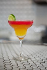 Glass of cocktail on counter