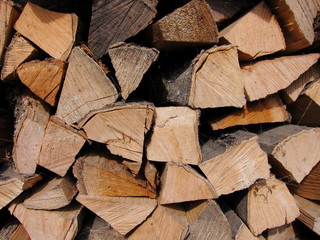 Pile of chopped fire wood prepared for winter. Texture