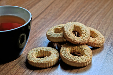 Tea and biscuits on a wooden table