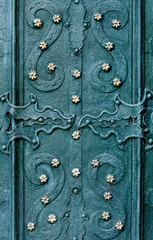 embossed metallic green-blue background with baroque details and with buttons and metal gold  flowers