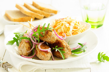 Kyufta kebab with salad close-up.