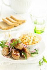 Kyufta kebab with salad close-up.