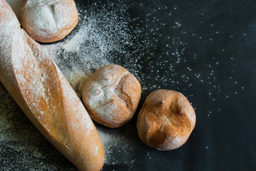 White Bread with Flour on Black Background