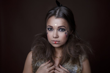 Portrait of a beautiful girl in the style of Indian America in a fur vest