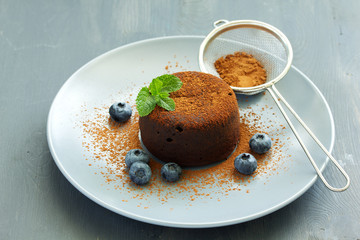 Fondant- delicious chocolate dessert with blueberries.