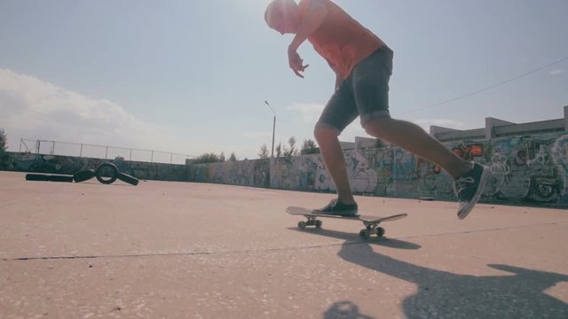 Skateboarders doing tricks during sunset in slowmotion. HD.