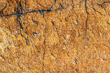 texture of brown stone or marble with vertical and horizontal cracks