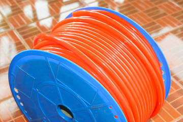 Orange air hose in role
