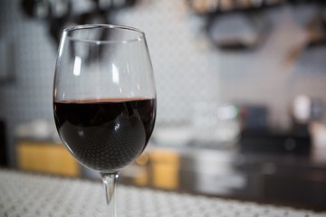 Glass of red wine on counter