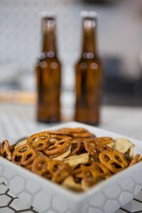 Bowl of snacks on bar counter