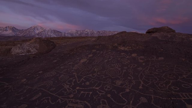 2 axis motion controlled time lapse with dolly in, pan right & zoom in motion of morning glow over Native American Petroglyphs in Eastern Sierra, California