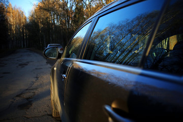 Fototapeta premium car autumn road, sun, concept autotravel