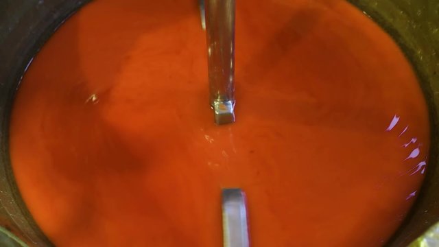 Orange paint being mixed in factory