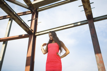 Portrait of a beautiful young girl at a construction site premises