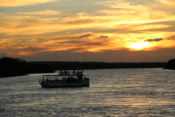 Boat trip to sunset at the Sambesi River, Zambia Africa