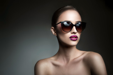 Portrait of beautiful sensual girl in sunglasses