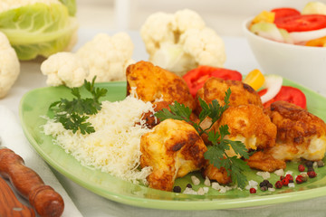 Breaded fried cauliflower with grated parmesan cheese, parsley and pepper