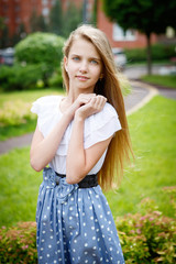 Fototapeta premium Portrait of a beautiful young girl in the Park