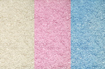 Fototapeta premium Textured background of colorful rice grains on the surface