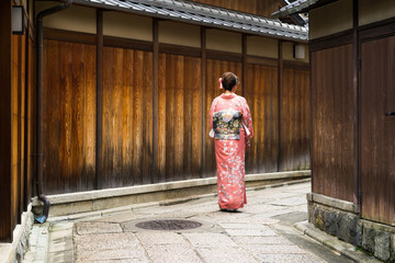 Female dressing in Kimono in streets of the Gion district in Kyoto, Japan