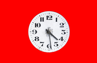 Dial watch on a red background. Old vintage clock face.