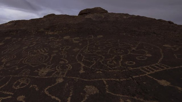 2 axis motion controlled time lapse with dolly pull & pan left motion of Native American Petroglyphs in the daytime in Eastern Sierra, California -Long Shot-