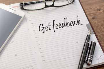 Fototapeta premium Text To do in a notebook (the diary) and a mobile phone, glasses