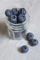 Fresh blueberries in a glass jar. Ripe blueberries 