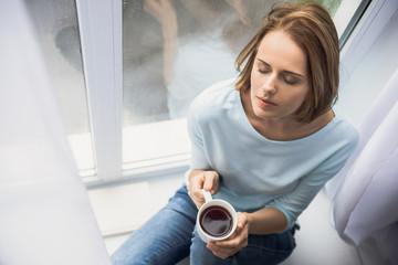 calm girl with cup of tea