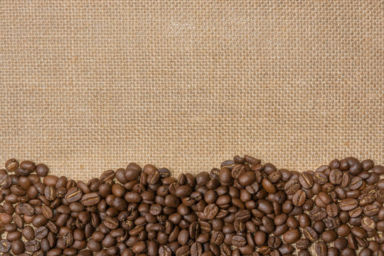 Coffee Beans On Gunny Sack Background