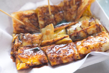 Fried Roti topping with chocolate fudge and banana inside