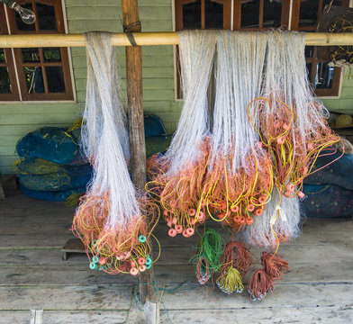 plastic fishernet hangs on the reling