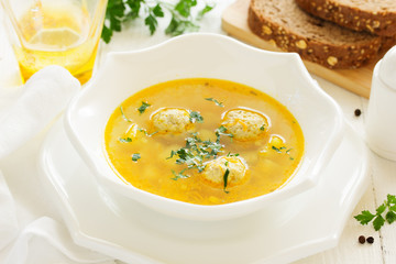 Homemade soup with chicken meatballs.