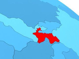 Fototapeta premium Tajikistan in red on blue globe