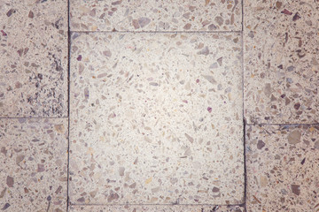 Old stone tiles. Background. The light shines in the middle.