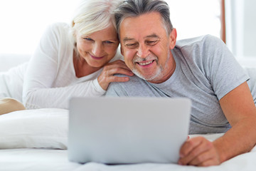 Senior couple using laptop
