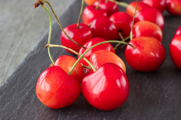 A fresh cherries on a gray background