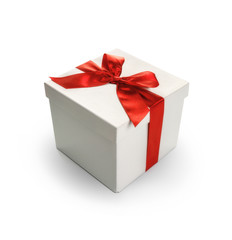 White gift box with red ribbon bow