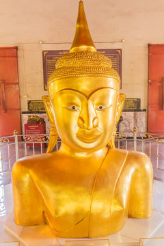 Phuket, Thailand - Sept 12, 2015: Strange Buddha statue at Pratong temple or Phra-phud temple. it is Buddha statue appear up from ground with half body. it is well-known destination for many tourists